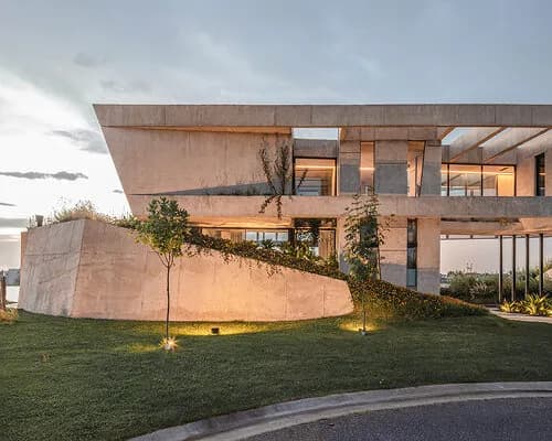 grizzo studio's 'casa lomadas' is shaped by folded concrete volumes in argentina
