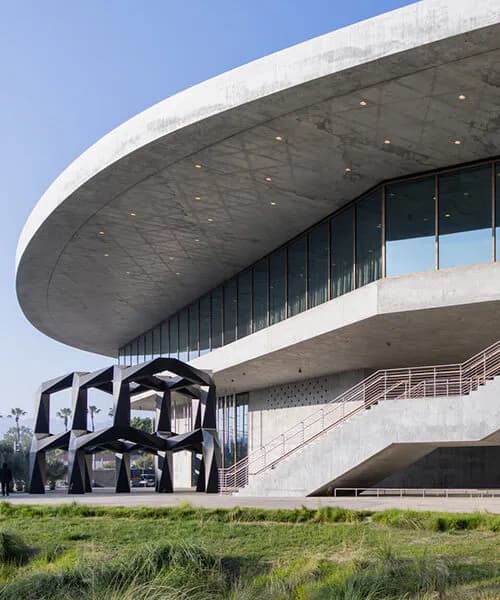 peter zumthor's david geffen galleries open at LACMA as a sweeping glass-and-concrete arc